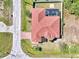 Bird's eye view of a home with a red tiled roof and screened in private pool at 10393 Harlingen St, Port Charlotte, FL 33981