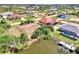 Aerial view of home near pond, showcasing its spacious lot and peaceful surroundings at 10393 Harlingen St, Port Charlotte, FL 33981