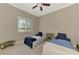 Bright bedroom featuring twin beds, neutral walls, and ample natural light at 10393 Harlingen St, Port Charlotte, FL 33981