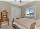 Cozy bedroom features neutral walls, a large closet and a sunny window view at 10393 Harlingen St, Port Charlotte, FL 33981
