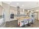 Well-equipped kitchen with granite countertops, stainless appliances, a large island, and pendant lighting at 10393 Harlingen St, Port Charlotte, FL 33981