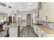 Modern kitchen featuring stainless steel appliances, granite countertops, and a large island with seating at 10393 Harlingen St, Port Charlotte, FL 33981