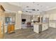 Spacious open floor plan showing the kitchen, living room, and access to the outdoor area, complemented by modern finishes at 10393 Harlingen St, Port Charlotte, FL 33981