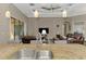 Inviting living room featuring modern lighting, neutral walls, and seamless indoor-outdoor flow at 10393 Harlingen St, Port Charlotte, FL 33981