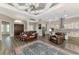 Spacious open-concept living area, features decorative ceiling, and modern kitchen with island seating at 10393 Harlingen St, Port Charlotte, FL 33981