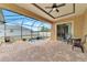 Screened-in pool area featuring a brick patio and outdoor seating at 10393 Harlingen St, Port Charlotte, FL 33981