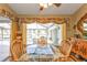 Breakfast nook with views of the pool, featuring a glass table and wooden chairs at 112 Great Isaac Ct, Punta Gorda, FL 33950