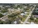 Aerial view of the property and surrounding neighborhood, highlighting the property's lot lines at 1169 Presque Isle Dr, Port Charlotte, FL 33952