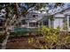 A fenced-in pool with a screened enclosure and tropical landscaping around a home's backyard at 1169 Presque Isle Dr, Port Charlotte, FL 33952