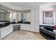 Bathroom with a jacuzzi tub, tile floor, and dual sinks at 1169 Presque Isle Dr, Port Charlotte, FL 33952