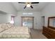 Bedroom with ceiling fan and access to the private pool area at 1169 Presque Isle Dr, Port Charlotte, FL 33952