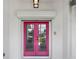 Eye-catching pink double front door at 1169 Presque Isle Dr, Port Charlotte, FL 33952