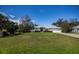 Charming single-story home with a well-maintained lawn and a two-car garage at 1169 Presque Isle Dr, Port Charlotte, FL 33952