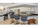 Spacious kitchen with white cabinets, breakfast bar, and tile flooring at 1169 Presque Isle Dr, Port Charlotte, FL 33952