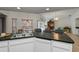 View of the kitchen with breakfast bar overlooking the living and dining areas at 1169 Presque Isle Dr, Port Charlotte, FL 33952