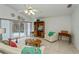 Bright living room with sliding glass doors to the pool and vaulted ceiling at 1169 Presque Isle Dr, Port Charlotte, FL 33952