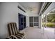 Outdoor patio with a ceiling fan, sliding glass doors, and a chair on a light concrete floor at 1169 Presque Isle Dr, Port Charlotte, FL 33952