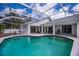 Screened-in pool with plenty of space for outdoor entertaining at 1169 Presque Isle Dr, Port Charlotte, FL 33952