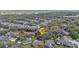 A high-angle view of a residential neighborhood, showcasing tree-lined streets and well-maintained homes at 1350 Old Oak Trl, Port Charlotte, FL 33948
