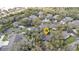 Overhead view of homes in community amidst tree-lined streets, showing a serene setting at 1350 Old Oak Trl, Port Charlotte, FL 33948