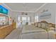 Charming bedroom with a decorative dresser, bay windows, and a comfortable bed at 1350 Old Oak Trl, Port Charlotte, FL 33948