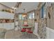 Cozy breakfast nook with a round glass table and bright floral curtains, perfect for morning meals at 1350 Old Oak Trl, Port Charlotte, FL 33948