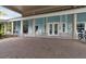 Exterior of clubhouse featuring light blue colors, ample seating, and bicycle parking at 1350 Old Oak Trl, Port Charlotte, FL 33948