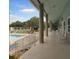 Picturesque view of the patio area, featuring seating, a pool, and scenic landscaping at 1350 Old Oak Trl, Port Charlotte, FL 33948
