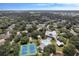 Wide aerial shot of community featuring amenities surrounded by lush trees and residential buildings at 1350 Old Oak Trl, Port Charlotte, FL 33948