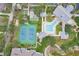 Aerial shot showcasing community amenities: pool, tennis courts, and shuffleboard at 1350 Old Oak Trl, Port Charlotte, FL 33948