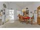 Bright dining room featuring a chandelier, elegant furniture, and an open doorway at 1350 Old Oak Trl, Port Charlotte, FL 33948