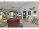 Bright living room featuring a vaulted ceiling, glass sliding doors, and unique decor at 1350 Old Oak Trl, Port Charlotte, FL 33948