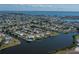 An aerial view of a canal-front home in a waterfront community at 137 Poinsettia Ne Cir, Port Charlotte, FL 33952