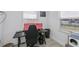 Office space with a window view, gaming chair, and sleek desk at 137 Poinsettia Ne Cir, Port Charlotte, FL 33952