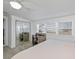 Bedroom with a built-in desk, a mirrored closet, and a ceiling fan at 137 Poinsettia Ne Cir, Port Charlotte, FL 33952