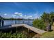 Private dock with a picturesque view of the calm waterway and lush green surroundings at 137 Poinsettia Ne Cir, Port Charlotte, FL 33952