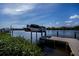 Private dock with a boat lift provides easy access to the scenic canal waterway at 137 Poinsettia Ne Cir, Port Charlotte, FL 33952