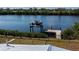 Waterfront property featuring a private dock with a boat lift and access to the canal at 137 Poinsettia Ne Cir, Port Charlotte, FL 33952