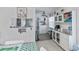 Bright kitchen with an open view, granite countertops, and white cabinetry at 137 Poinsettia Ne Cir, Port Charlotte, FL 33952