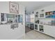 Bright kitchen area with a serving counter, pantry storage, and lots of natural light at 137 Poinsettia Ne Cir, Port Charlotte, FL 33952