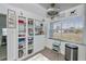 Well-organized pantry with shelving, containers, and a view to the outside at 137 Poinsettia Ne Cir, Port Charlotte, FL 33952