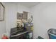 Utility area featuring a washer, a water heater, and essential plumbing fixtures for household convenience at 137 Poinsettia Ne Cir, Port Charlotte, FL 33952