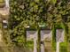 Aerial view of well-maintained homes surrounded by lush greenery with private driveways and manicured lawns at 1470 Atwater Dr, North Port, FL 34288