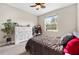 Bright bedroom featuring a large window and comfortable furnishings and decor at 1470 Atwater Dr, North Port, FL 34288