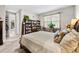 Bedroom with cozy rug, large window and bookshelves at 1470 Atwater Dr, North Port, FL 34288