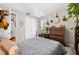 Bedroom with chandelier, rustic dresser, and decor at 1470 Atwater Dr, North Port, FL 34288