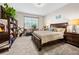 Cozy bedroom with large window, neutral colors, and matching nightstands at 1470 Atwater Dr, North Port, FL 34288