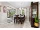 Bright dining room with sliding glass doors to lanai, table, and beautiful china cabinet at 1470 Atwater Dr, North Port, FL 34288
