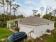 Exterior view of the home showcasing a two-car garage and driveway, with a landscaped yard at 1470 Atwater Dr, North Port, FL 34288