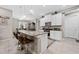 Modern kitchen with granite countertops, stainless steel appliances, and seating at the breakfast bar at 1470 Atwater Dr, North Port, FL 34288